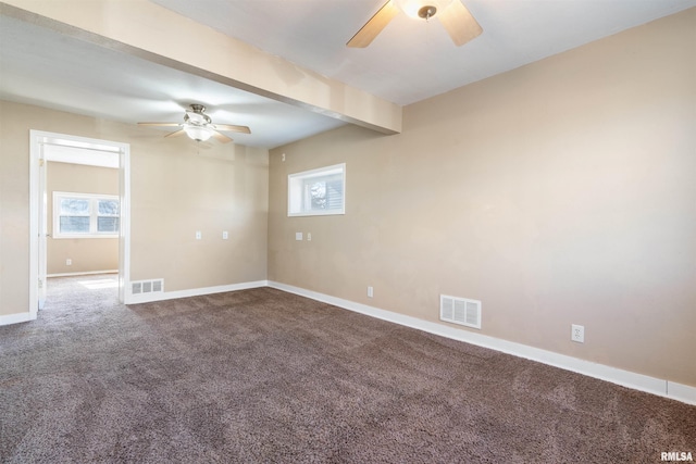 carpeted empty room featuring visible vents, beamed ceiling, baseboards, and ceiling fan