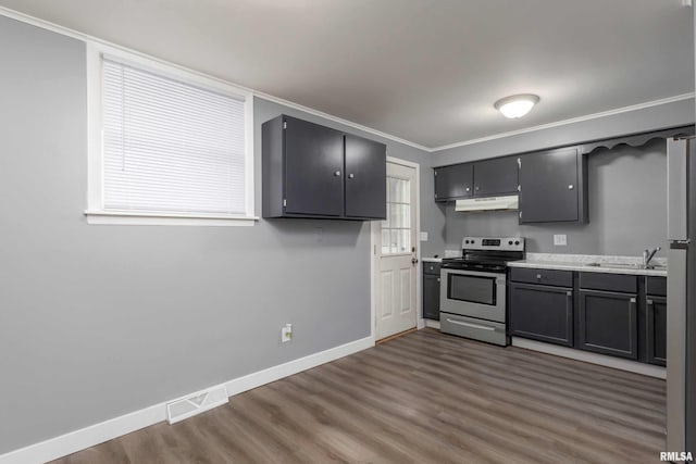 kitchen with visible vents, baseboards, appliances with stainless steel finishes, dark wood-style flooring, and under cabinet range hood