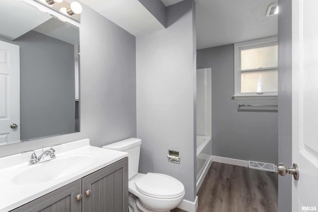 full bath with baseboards, visible vents, vanity, and toilet