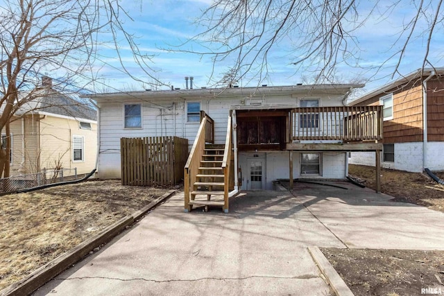 back of property with stairway and a deck