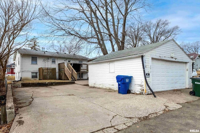 exterior space featuring an outbuilding and a detached garage