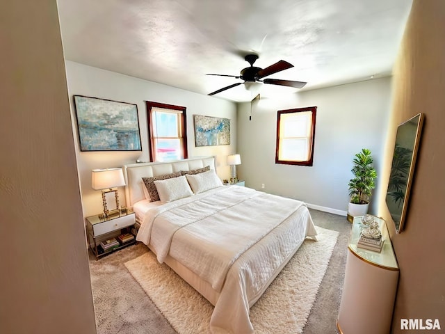 bedroom featuring carpet flooring, ceiling fan, and baseboards