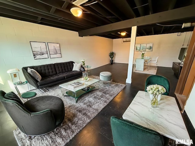 living area featuring beam ceiling