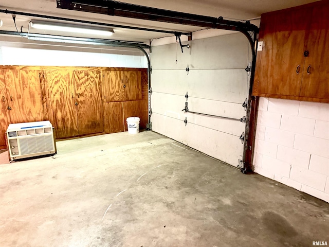 garage featuring a wall unit AC