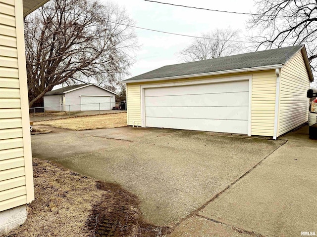 detached garage with fence