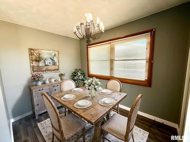 dining room with baseboards, dark wood finished floors, and a notable chandelier