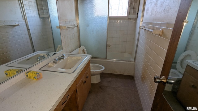 bathroom featuring enclosed tub / shower combo, tile walls, toilet, and vanity