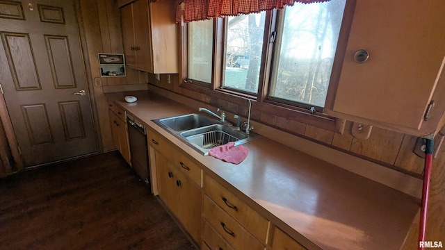 kitchen featuring dark wood-style floors, black dishwasher, light countertops, and a sink