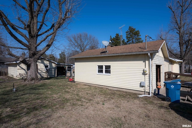 view of home's exterior with a lawn