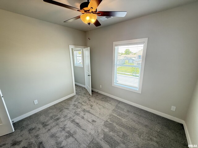 1631 Westport Dr, Davenport, IA 52804 - spare room with ceiling fan and carpet