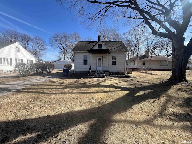 view of front of house featuring a chimney