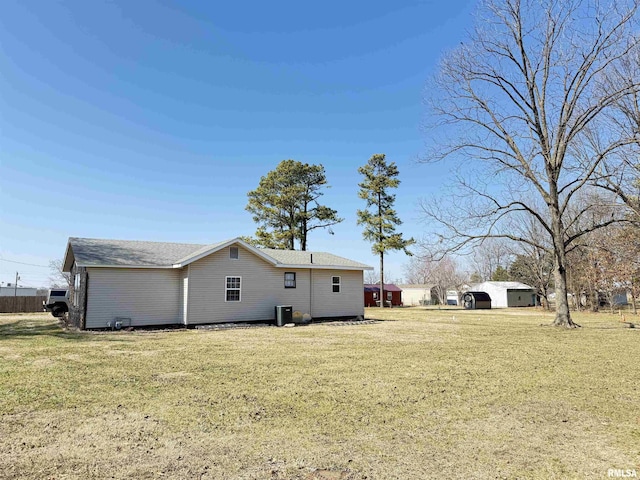 back of property with a lawn