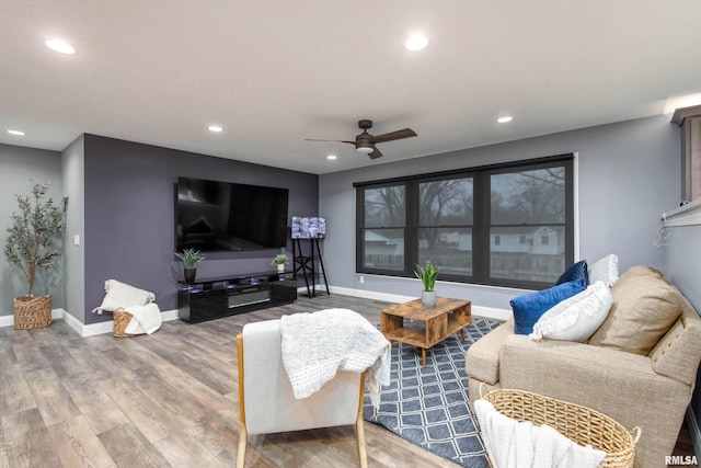 living room with recessed lighting, wood finished floors, a ceiling fan, and baseboards