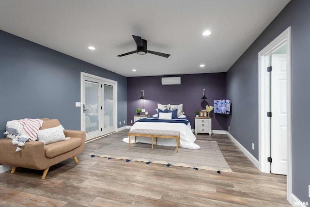 bedroom featuring ceiling fan, recessed lighting, wood finished floors, baseboards, and access to outside