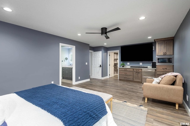 bedroom featuring recessed lighting, baseboards, ensuite bath, and light wood finished floors