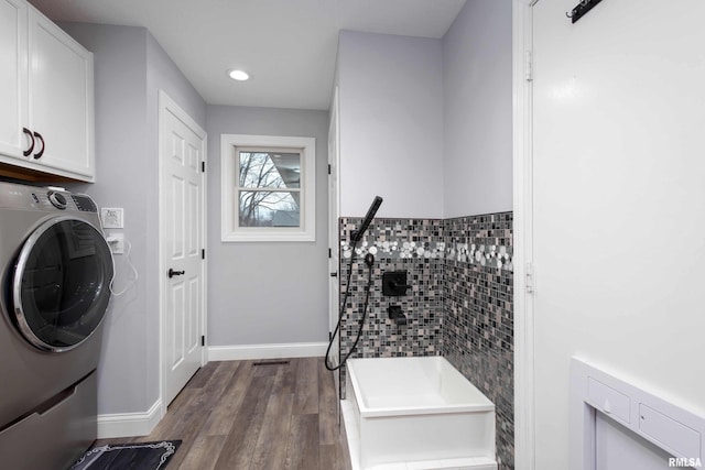 laundry room featuring recessed lighting, baseboards, cabinet space, dark wood-style floors, and washer / dryer