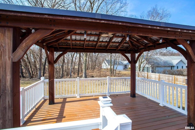 deck featuring fence and a gazebo