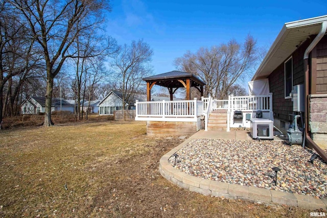 view of yard with a wooden deck and a gazebo