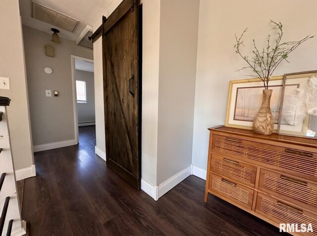 506 Timothy Ln, Carterville, IL 62918 - hall featuring a barn door, wood finished floors, baseboards, and a baseboard radiator