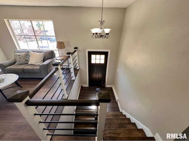 506 Timothy Ln, Carterville, IL 62918 - foyer entrance featuring a chandelier, baseboards, wood finished floors, and stairway