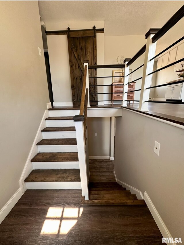506 Timothy Ln, Carterville, IL 62918 - staircase featuring baseboards, wood finished floors, and a barn door