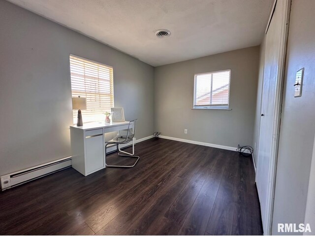 506 Timothy Ln, Carterville, IL 62918 - office space featuring a baseboard radiator, dark wood-type flooring, and baseboards