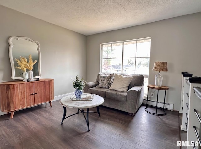 506 Timothy Ln, Carterville, IL 62918 - living area with a baseboard heating unit, dark wood-style flooring, and a textured ceiling