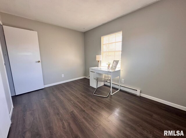 506 Timothy Ln, Carterville, IL 62918 - home office featuring baseboard heating, wood finished floors, and baseboards
