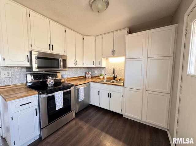 506 Timothy Ln, Carterville, IL 62918 - kitchen featuring appliances with stainless steel finishes, a sink, butcher block counters, and white cabinets