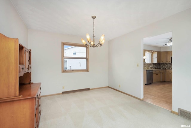 unfurnished room featuring baseboards, visible vents, and light colored carpet