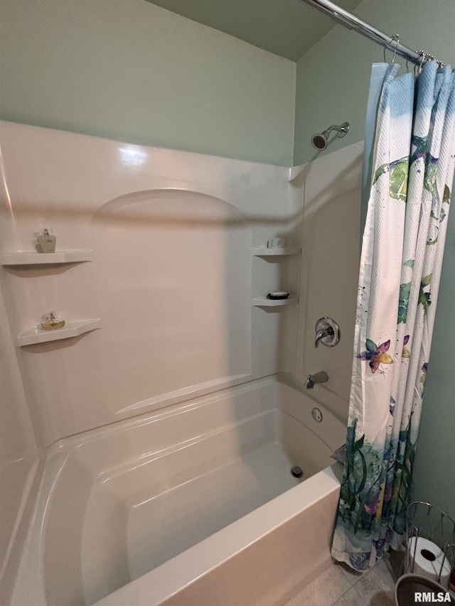 bathroom with shower / bathtub combination with curtain and tile patterned floors