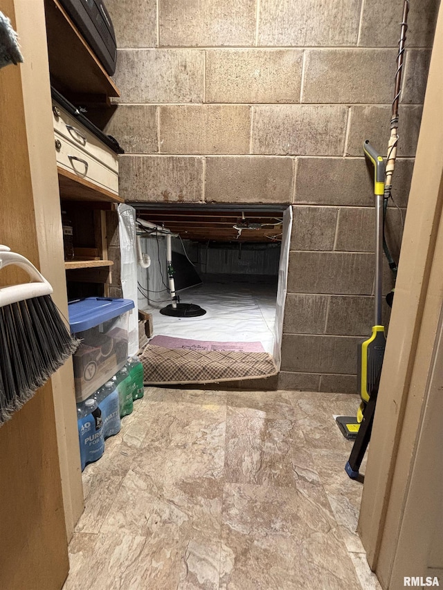 bathroom with concrete block wall