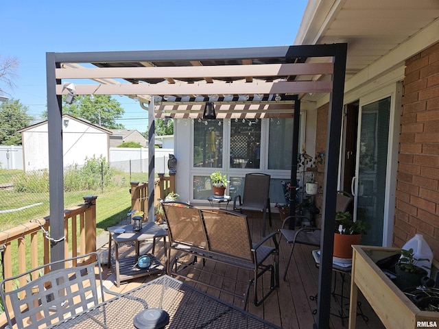 wooden deck featuring outdoor dining space, fence, and a pergola