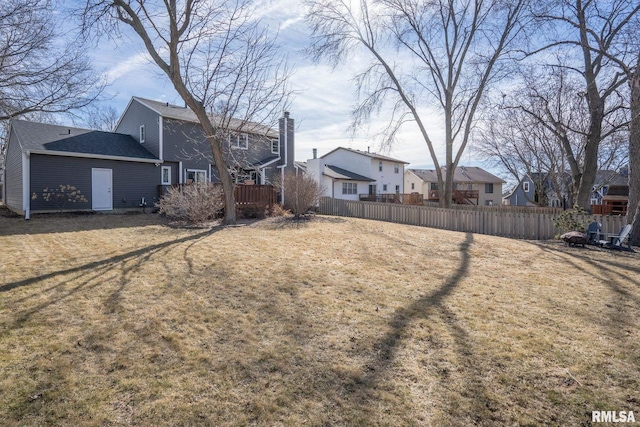 view of yard featuring a residential view and fence