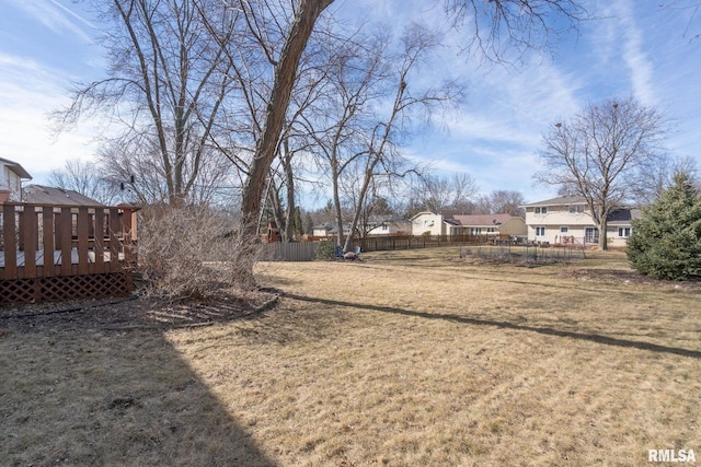 view of yard with fence and a wooden deck