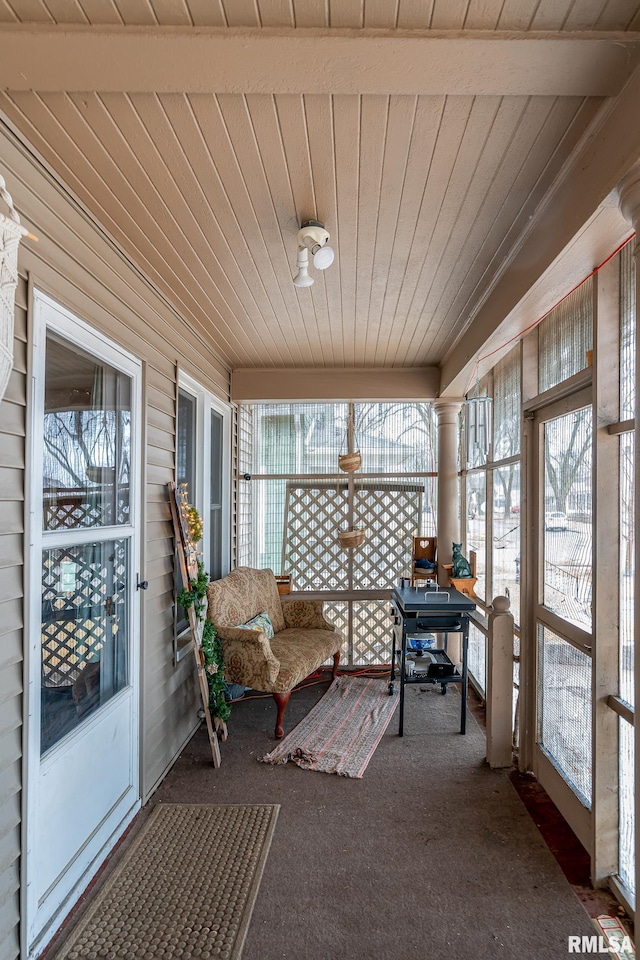 sunroom / solarium featuring wooden ceiling