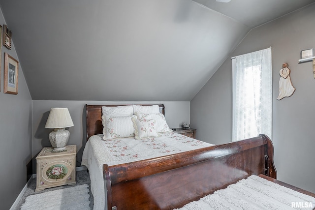 bedroom with lofted ceiling