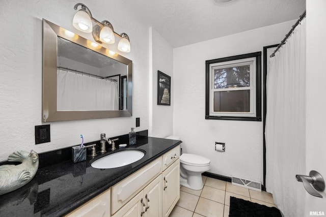 full bath with toilet, vanity, visible vents, and tile patterned floors