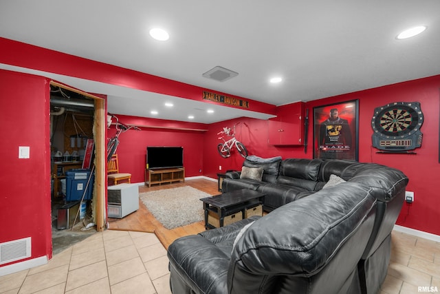 living room featuring baseboards, visible vents, tile patterned flooring, and recessed lighting