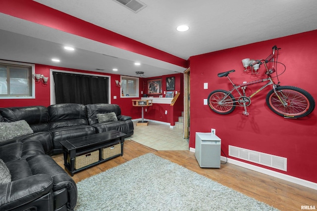 home theater room featuring recessed lighting, wood finished floors, visible vents, and baseboards