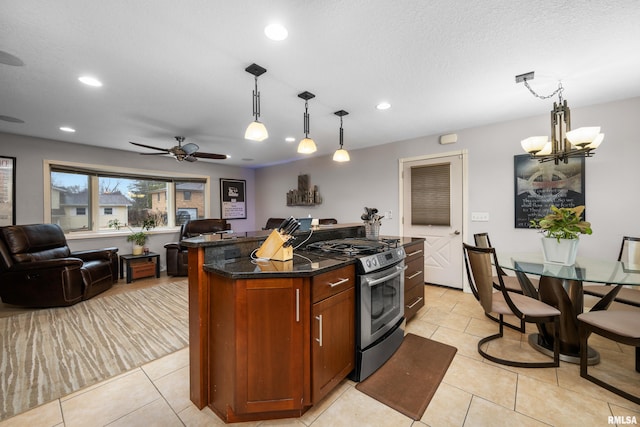 kitchen featuring light tile patterned floors, a kitchen island, open floor plan, hanging light fixtures, and stainless steel range with gas cooktop