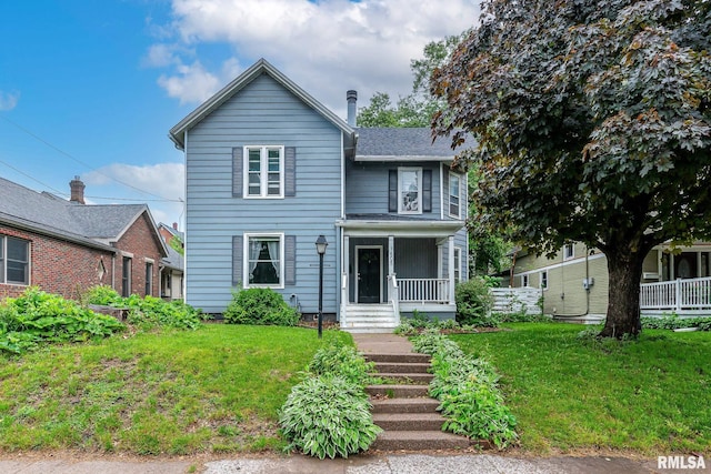 traditional-style house with a porch and a front lawn