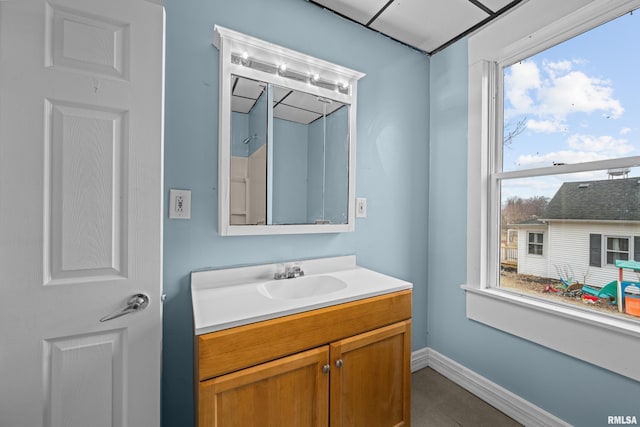 bathroom featuring vanity and baseboards