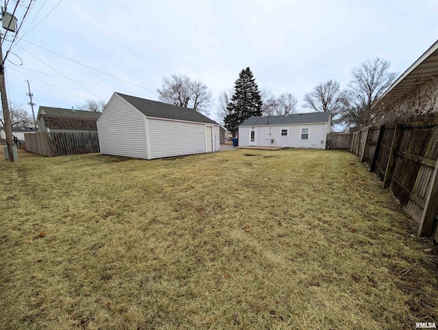 view of yard with an outbuilding and fence private yard