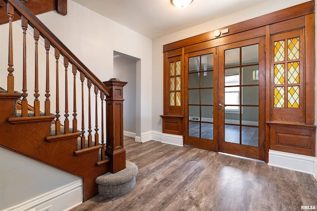 entryway featuring stairs, french doors, wood finished floors, and baseboards