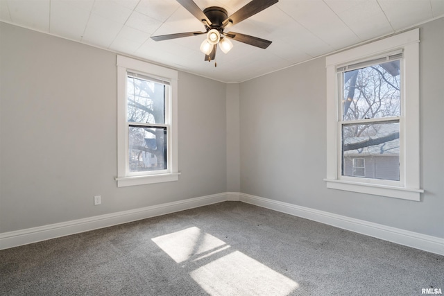 unfurnished room featuring ceiling fan, carpet flooring, and baseboards