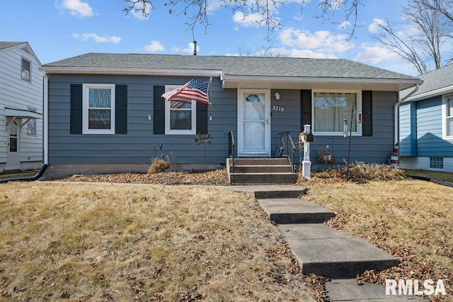 view of front of house featuring a shingled roof