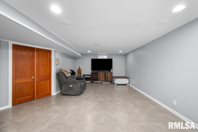 living area with light floors, baseboards, and recessed lighting