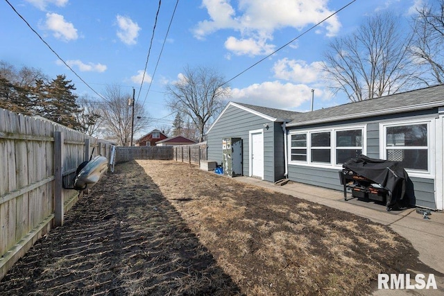 exterior space featuring a fenced backyard