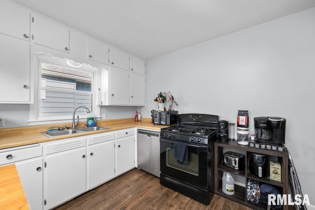 kitchen featuring white cabinets, dark wood-type flooring, black range with gas stovetop, stainless steel dishwasher, and a sink